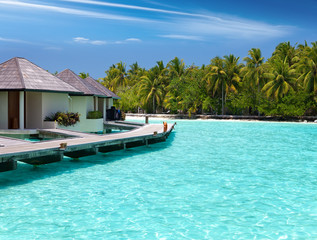 Fototapeta na wymiar houses on piles on sea. Maldives