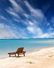 Fototapeta na wymiar beach chair on the seashore