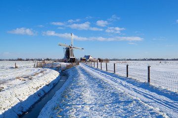 Dutch windmill during snowy winter