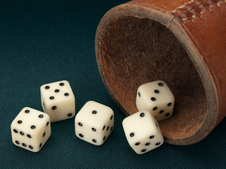 Five dice and leather cup