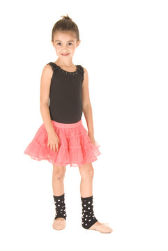 Young girl in ballerina outfit looking at camera