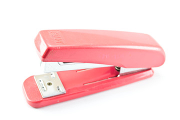 pink stapler on a white background