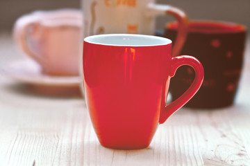 red cup on wood table
