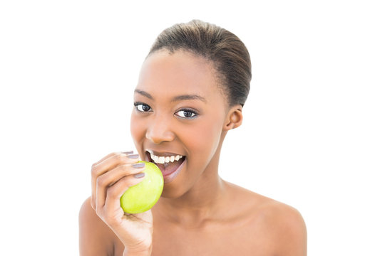 Cheerful natural beauty biting green apple