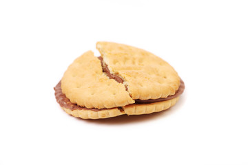 Fototapeta na wymiar Broken sandwich biscuits with chocolate cream.
