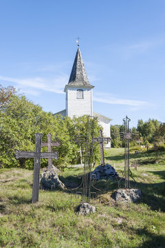 Graveyard crosses and white church