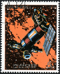 Fototapeta premium stamp printed in North Korea shows a space station