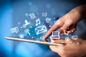 Finger pointing on tablet pc, social media concept © ra2 studio