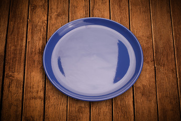 Colorful empty plate on grungy background table