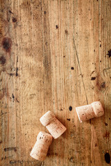 Bottle corks on a wooden background