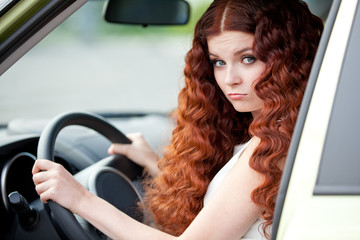 Fototapeta na wymiar Woman sitting in car