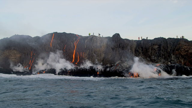 People Watching Molten Lava Kilauea Hawaii Pouring Into Ocean 