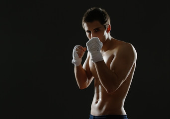 Half-length portrait of exercising sportsman 