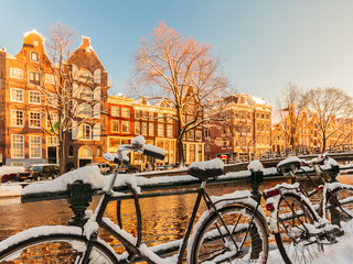 Bicycles covered with snow during winter in Amsterdam