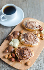 Fototapeta na wymiar Slices of bread with chocolate cream and nuts