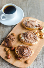 Slices of bread with chocolate cream and nuts