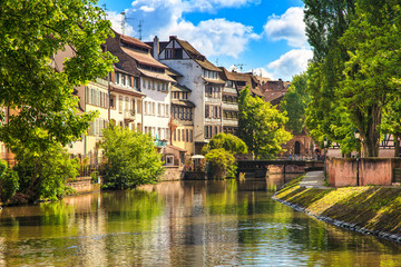 Strasbourg, water canal in Petite France, Unesco site. Alsace. - obrazy, fototapety, plakaty