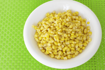 grains of corn on green tablecloth