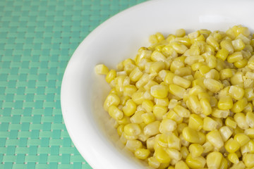 grains of corn on blue tablecloth