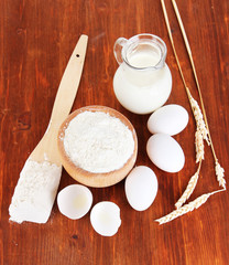 Ingredients for dough on wooden table close-up