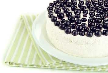 Cheesecake with fresh berries on white plate closeup