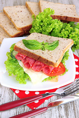 Composition with fruit juice and tasty sandwich with salami