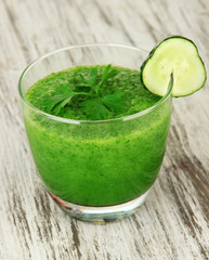 Green vegetable juice on table close-up