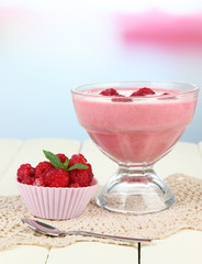 Raspberry milk dessert, on light background