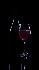 Naklejka na ściany i meble Red wine bottle and full glass