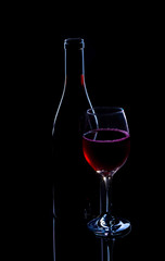 Red wine bottle and full glass