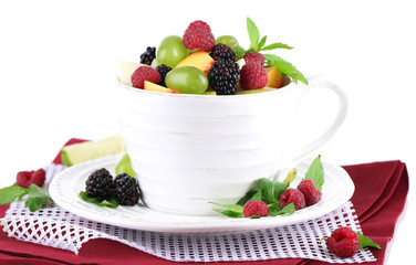 Fruit salad in cup on napkin isolated on white