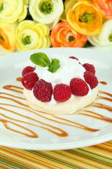Tasty meringue cake with berries, close up