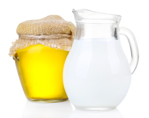 Honey and milk isolated on white