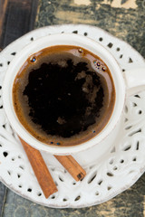 cup of coffee on old book