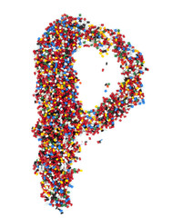 P shaped colorful plastic polymer granules on white background