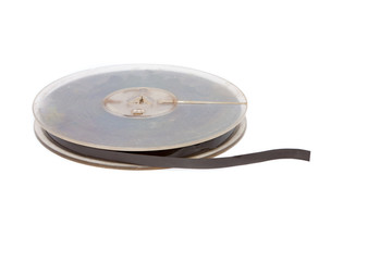 Vintage reel of audio tape on white background