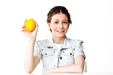 beautiful girl with lemon in hand