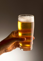 Hand with a glass of beer