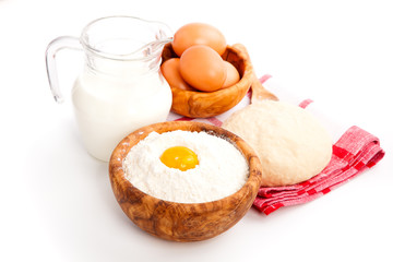 Milk, flour and eggs, ingredients for baking. isolated on a whit