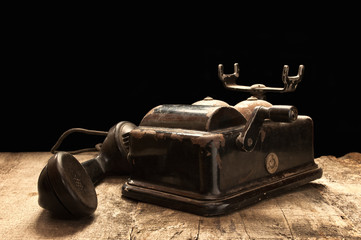 Old phone in dusty and rusty condition.