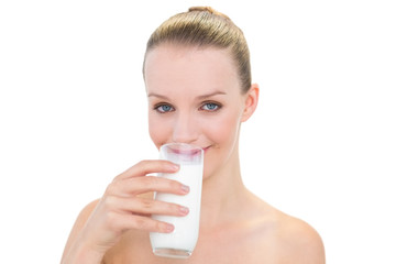 Peaceful pretty blonde model drinking milk