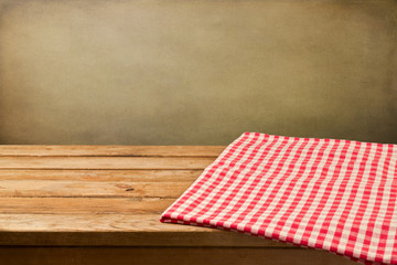 Background with empty wooden table with tablecloth