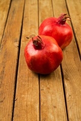 Fototapeta na wymiar Pomegranate on wooden deck table