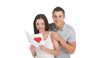 Loving couple. Beautiful young loving couple standing isolated o