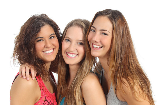 Group of three women laughing and looking at camera