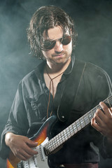 Psychedelic rock guitarist with long brown hair and beard. Weari