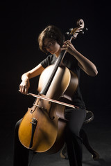 Young woman plays cello © mikhaluk