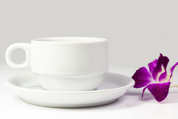 Coffee cup and saucer on a white background.