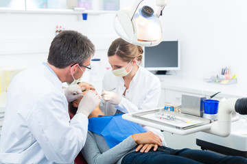 Patient with Dentist - dental treatment