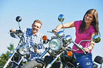 Young couple outdoors on bikes